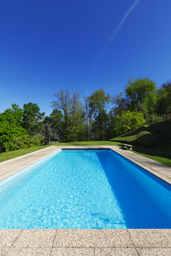 Empty pool in front of a blue sky