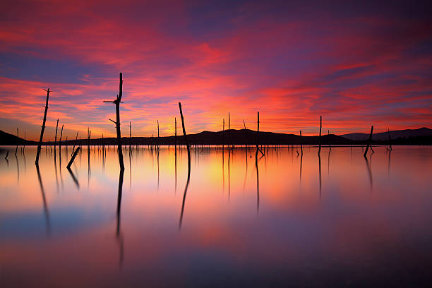 Amazing colorfull sunset over Garaio Lake stock photo