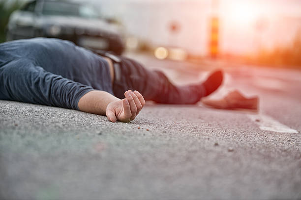 Traffic accident.Young man hit by a car Traffic accident.Young man hit by a car hazard sign photos stock pictures, royalty-free photos & images