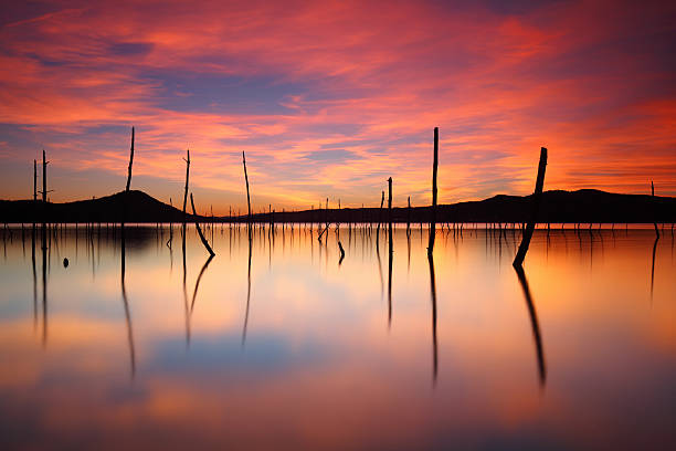 Amazing sunset over Garaio Lake stock photo