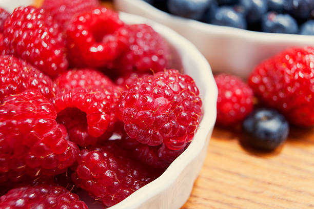 Raspberries and blueberries stock photo