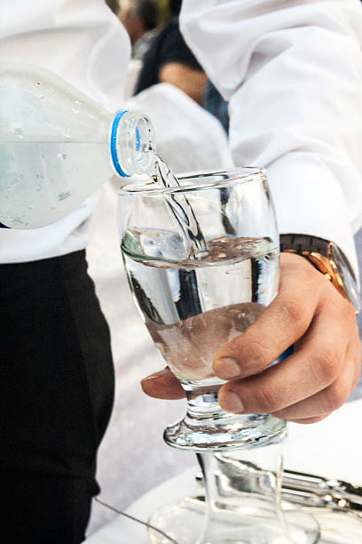 Pouring water from plastic bottle stock photo
