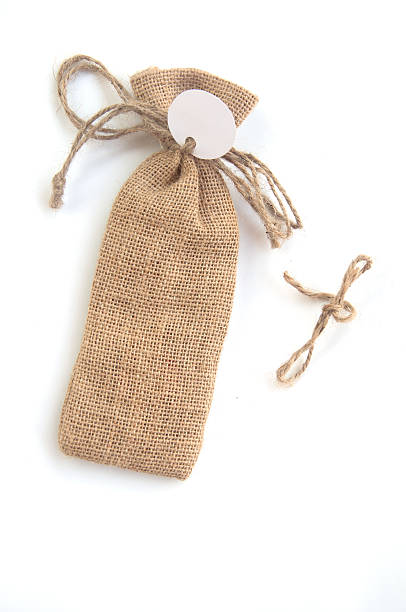 istock burlap sack with tag on white,souvenir in wedding 503759982