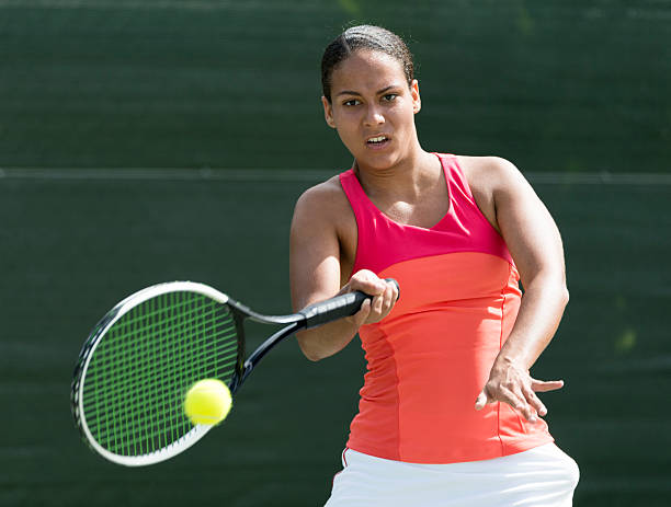 istock Young mixed race girl playing tennis 503760036