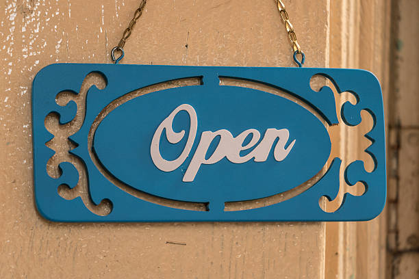 istock sign hanging in the front door open. 503760142