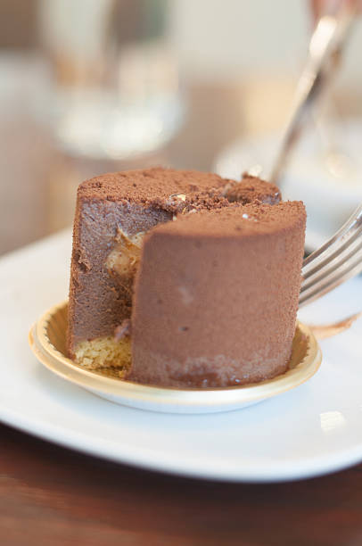 istock eating of chocolate cake in coffee shop 503760672