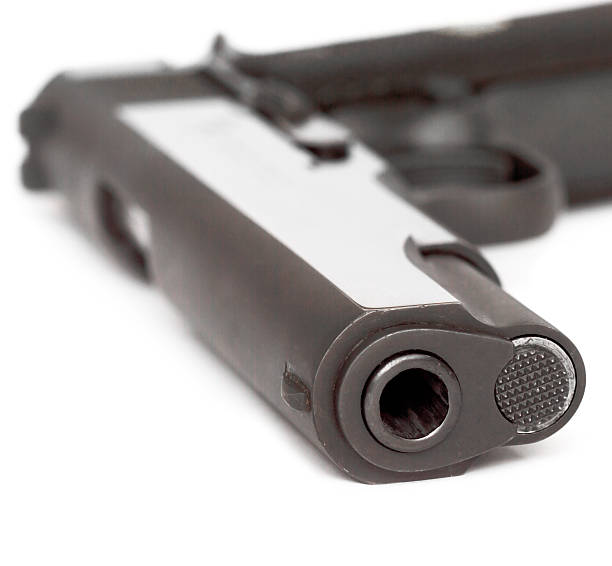 istock 9 mm pistol and cartridges 503761259