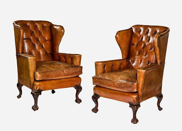 istock antique leather wing chair carved legs isolated with clip path 503762956