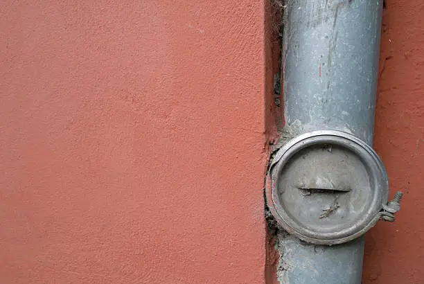 Photo of Drain on a house wall