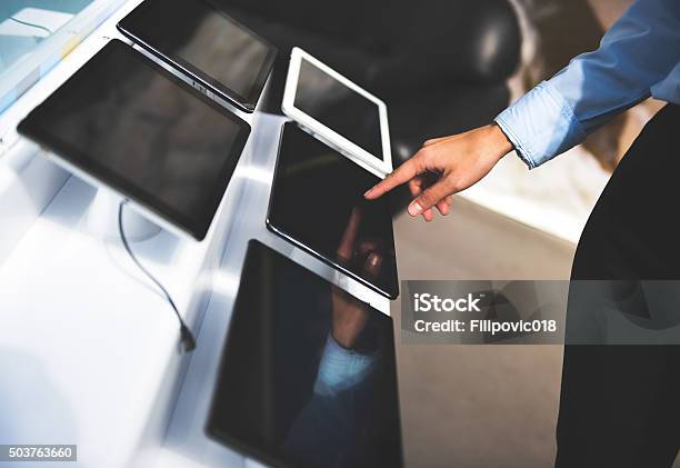 Buying Tablet Stock Photo - Download Image Now - Store, Electronics Industry, Electrical Equipment