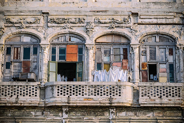 Architecture of old and ruined Havana, Cuba. Balconies on building in rough shape after years of neglect and lack of renovation.
