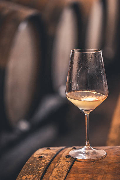istock Glass of White Wine on a Barrel, Selective Focus, Close-up 503765150