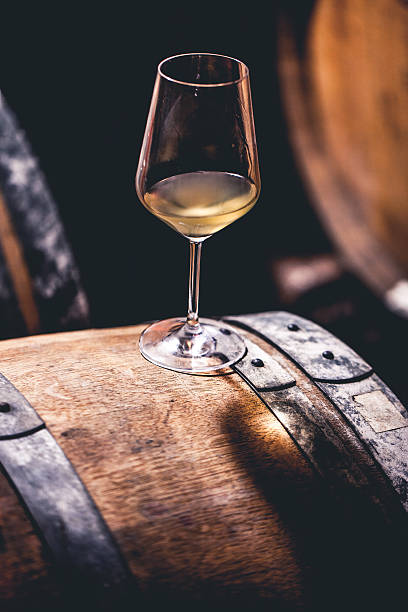 istock Glass of Wine on a Barrel, Close-up 503765728