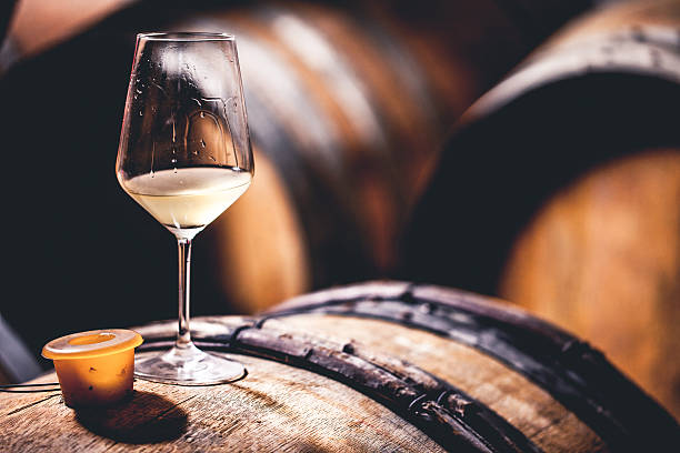 istock Glass of Wine on a Barrel 503766242