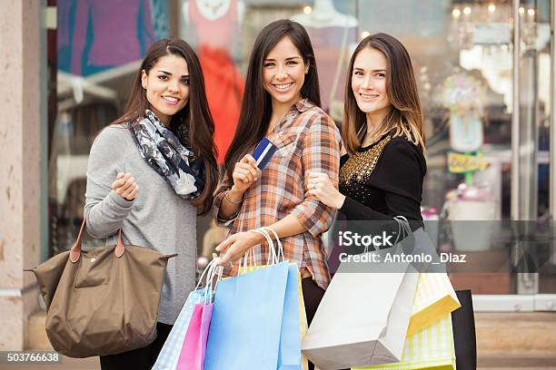 Happy Women Shopping Together At A Mall Stock Photo - Download Image Now - 20-29 Years, Adult, Adults Only