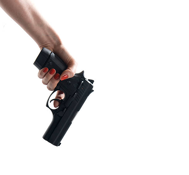 istock Hand Woman holding gun pistol 503776356