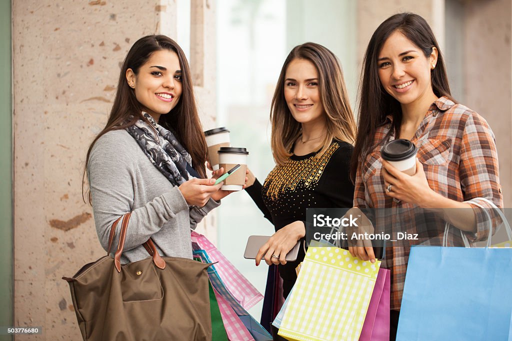 Beautiful Hispanic women at a shopping center Portrait of a group of three gorgeous Hispanic women doing some shopping and hanging out at a mall 20-29 Years Stock Photo