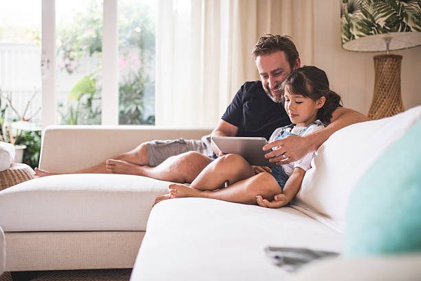 istock Watching funny videos with her dad 503778052