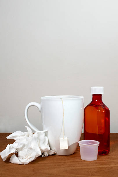 istock Flu and cold theme with medicine, tissue, cup and tea. 503779088