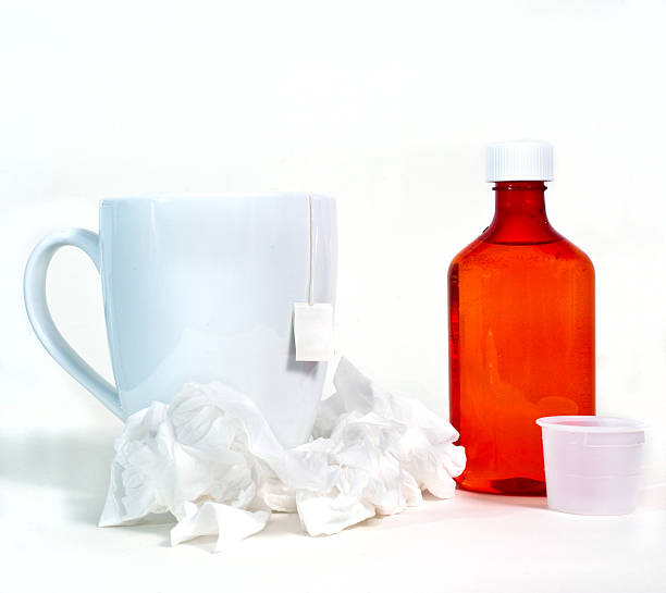 istock Flu and cold theme with medicine, tissue, and tea. 503779190