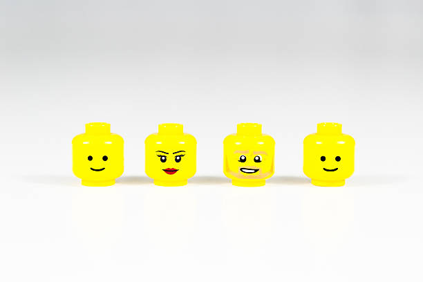 lego mini-abbildung heads - staring black and white glasses human face stock-fotos und bilder