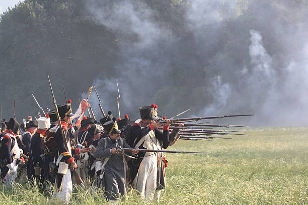 La Albuera, Spain - May 9, 2015: Reenactment of Albuera battle between French and allied nations armies in 1811. May 9, 2015 in La Albuera, Badajoz, Spain. Soldiers fire muskets
