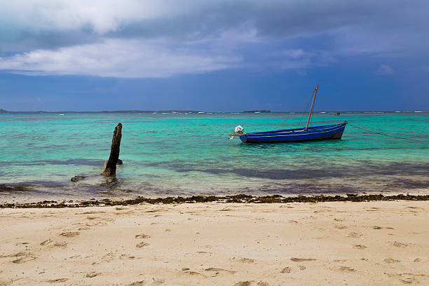 istock Boat on the shore of a tropical beach 503783612