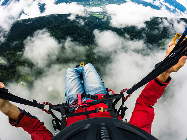 Flying over the clouds with a paraglider