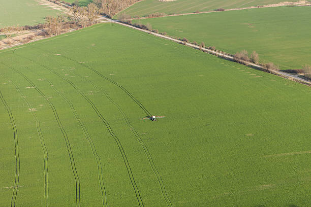 istock aerial view of harvest fields with tractor 503784058