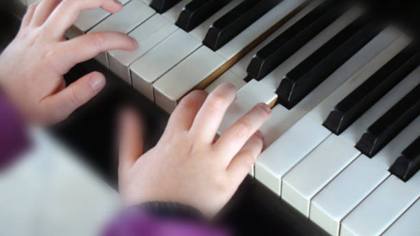 istock Hand Playing Classical Music With Piano Keyboard 503785280