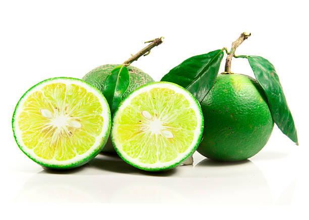 limes fresco isolato su bianco - lemon portion cross section isolated foto e immagini stock