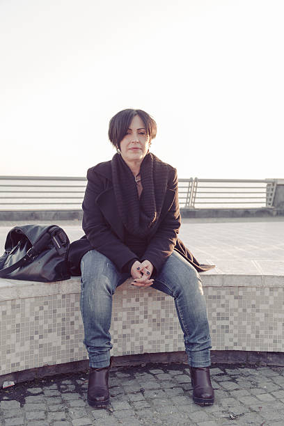 istock Woman sitting on Bench at Sunset 503785970