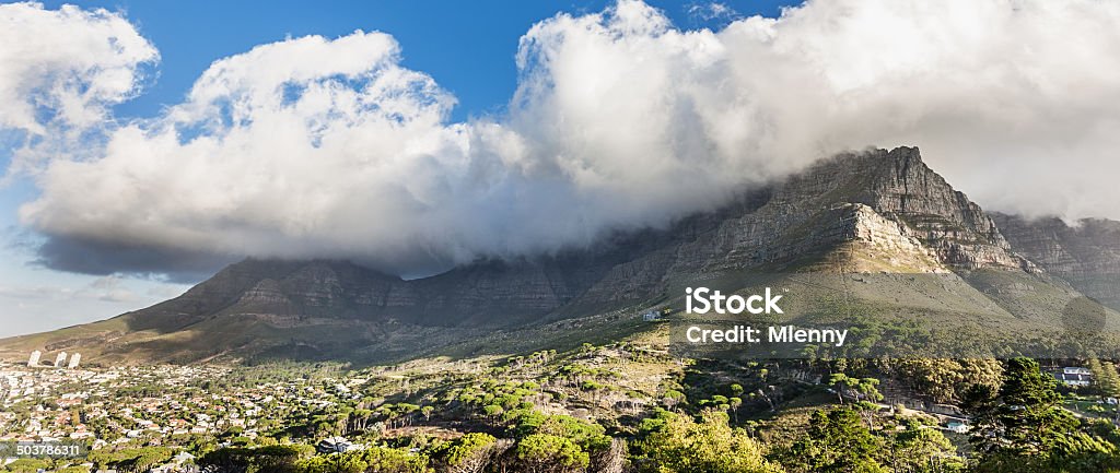 Cape Town City Table Mountain Panorama Beautiful city of Cape Town under famous Table Mountain with stunning clouds on top. Panoramic view. Cape Town, South Africa. Africa Stock Photo