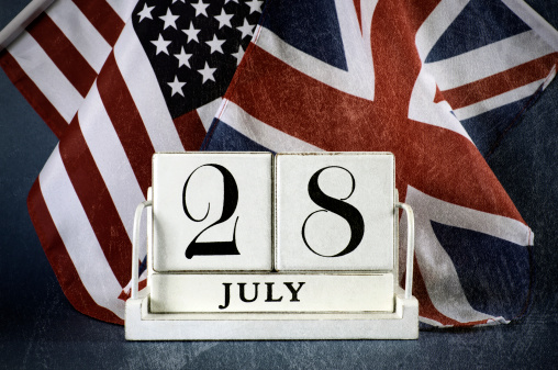 Aged, grunge style, vintage style white block calendar for 28 July, start of World War I, centenary, 1914 to 2014, with USA, stars and stripes, and UK, Union Jack, flag. Aged grunge filter.