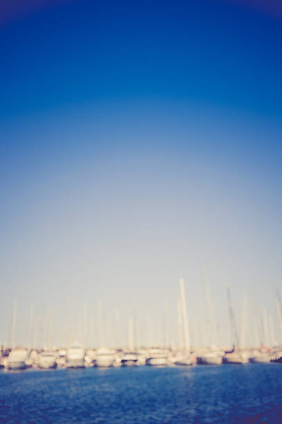 defocused summer background with yachts. yachts in harbour. defocused summer background. truism stock pictures, royalty-free photos & images