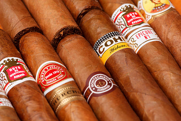 Cuban cigars Ciudad de Mexico, Mexico - August 1, 2015: Cuban Cigars.  All cigar production in Cuba is controlled by the Cuban government, and each brand may be rolled in several different factories in Cuba. cigar photos stock pictures, royalty-free photos & images