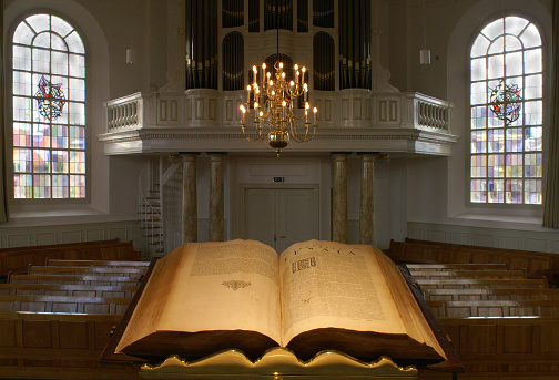 Dutch protestants church interior, seen from the pulpit, with open Bible