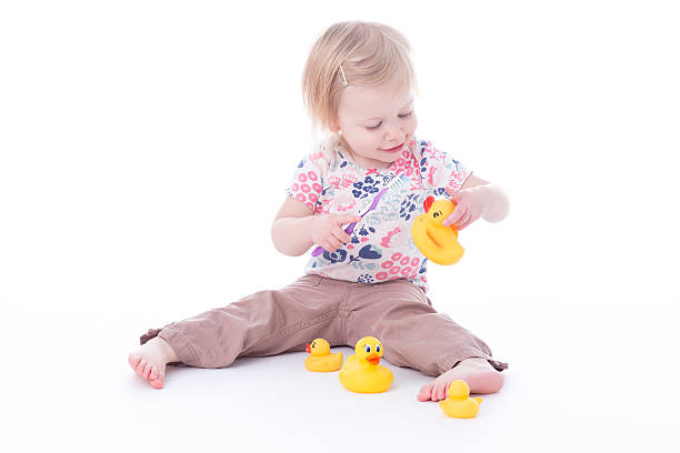 istock toddler girl brushing duck teeth 503792120