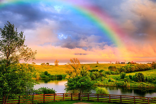 Rainbow over countryside stock photo
