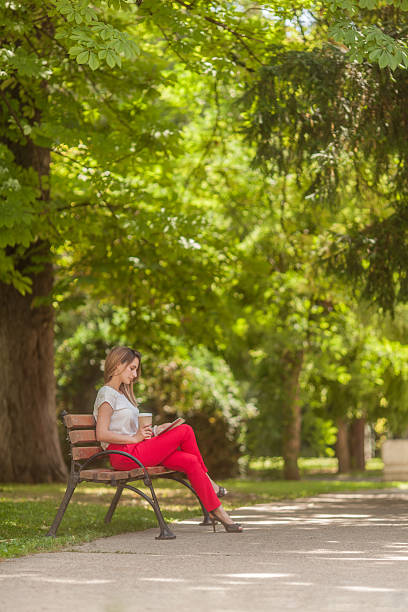 istock Businesswoman sitting on a bench drinking coffee 503801981
