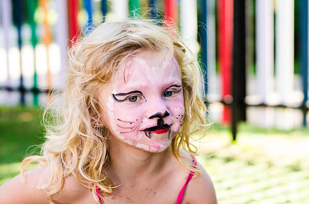 istock girl with face painting 503802987