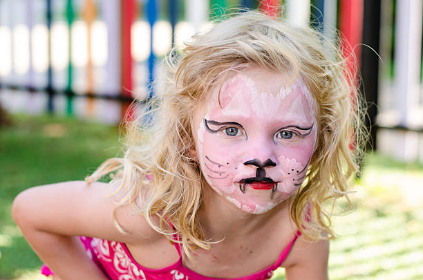 istock girl with face painting 503803001