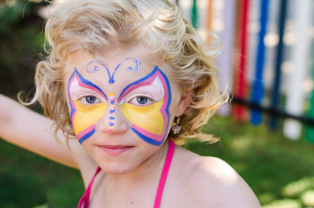 istock girl with face painting 503803021