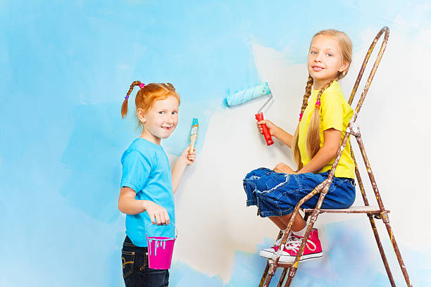 istock Two smiling girls with brushes 503803627