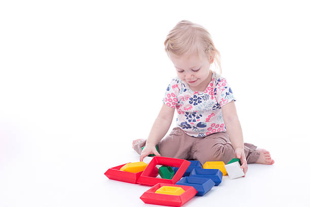 istock toddler girl stacking blocks 503803894