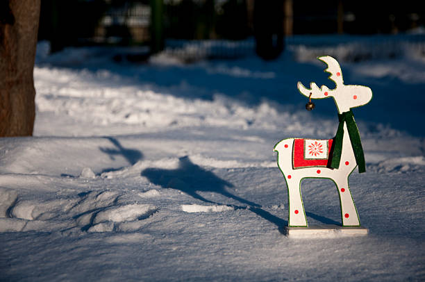 istock Wooden deer at snow 503804748
