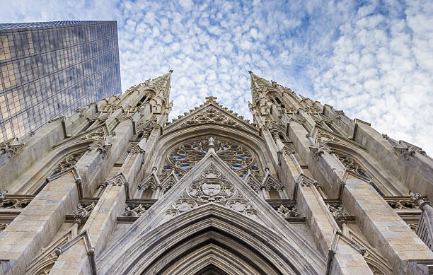 Front of St. Patricks Cathedral and skyscraper in New York stock photo