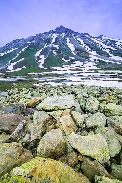 stone with snow mountain