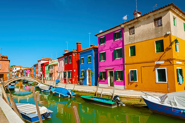 Venice, Italy Burano island canal, colorful houses and boats, Italy. murano stock pictures, royalty-free photos & images