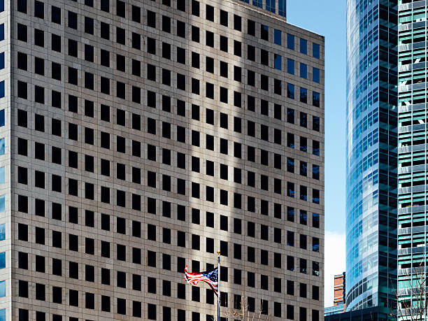 istock American flag, skyscrapers in background 503810668